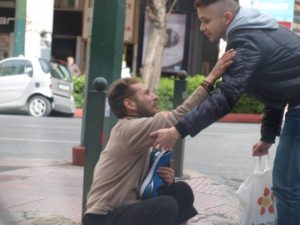 man giving new blue shoes to another man