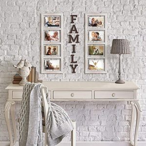 a white table below to sets of family portraits with the words family between them