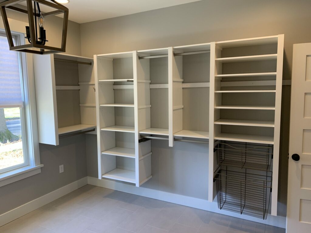 empty white hanging closet shelving