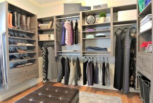 organized custom closet with hanging wardrobe