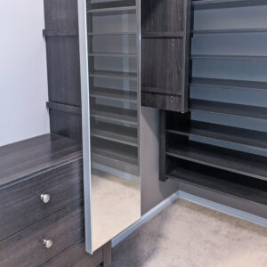 Glide-out mirror shown between drawers and shoe shelving sections.