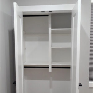Double door coat closet with hanging and shelving storage