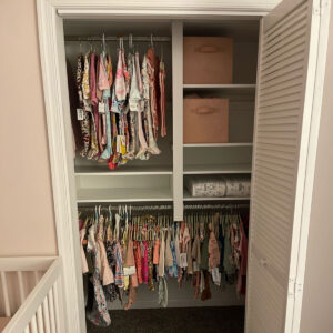 reach in closet with hanging baby clothes